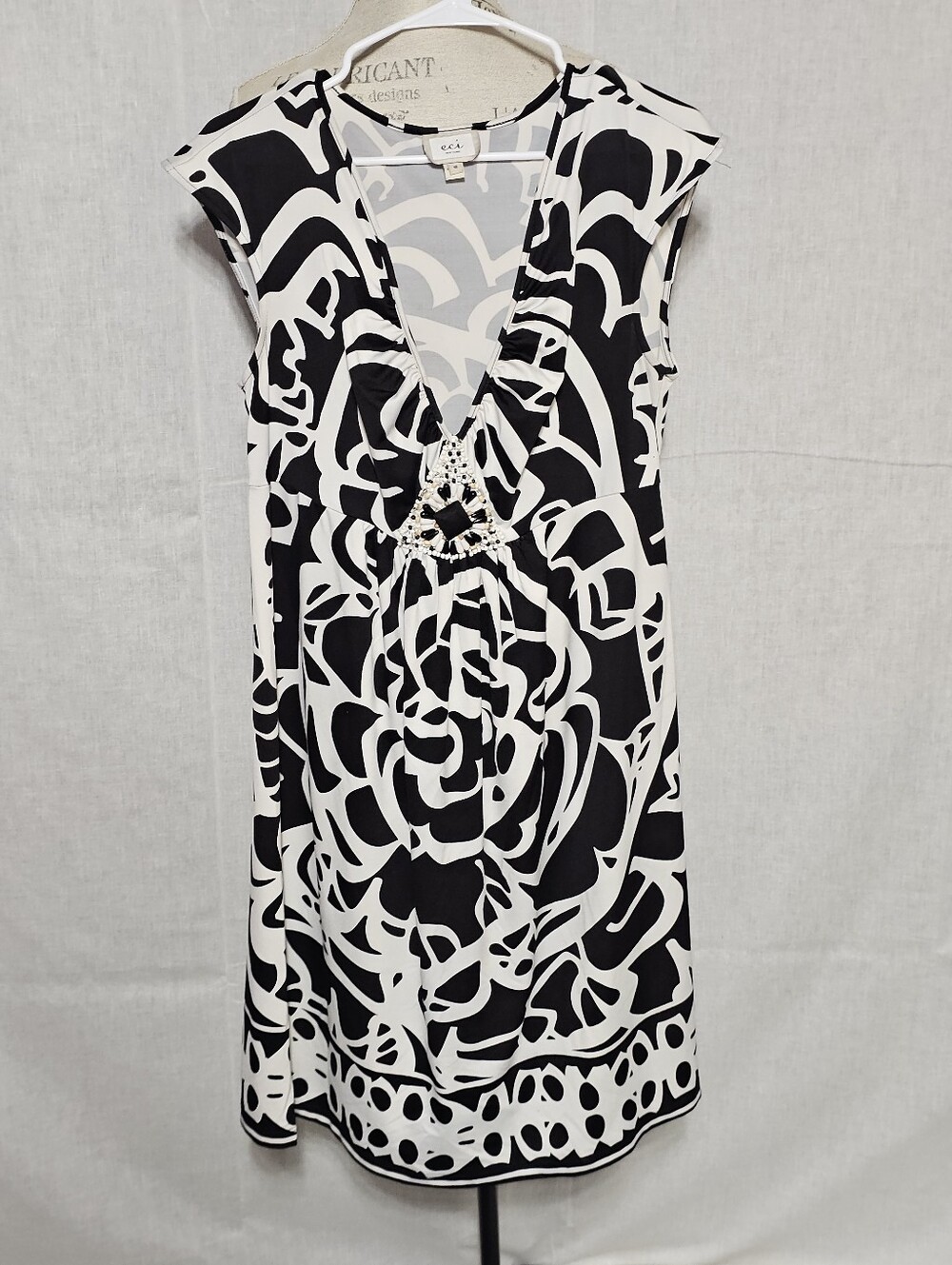 ECI Black and White Abstract V-Neck Dress with Crochet Accent